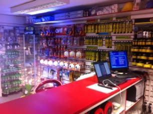 Shelves of lamps, plugs and accessories behind the trade counter